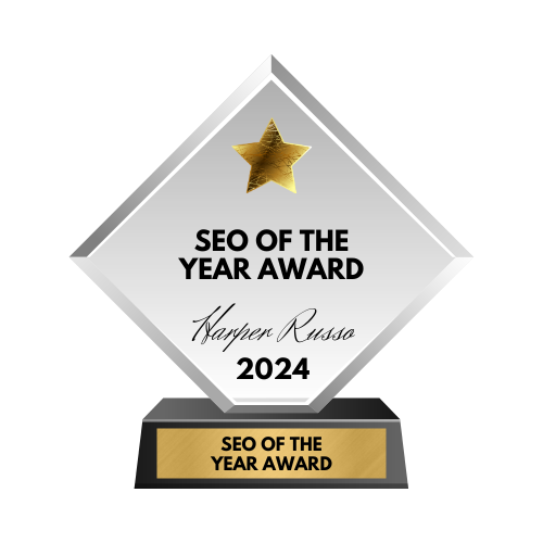 A close-up of a framed certificate showcasing a SEO of the Day" award badge from a renowned web design platform.